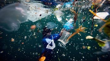 Turkish world record-holder free-diver and divers of the Underwater Federation Sahika Encumen dives amid plastic waste in Ortakoy coastline to observe the life and pollution of Bosphorus in Istanbul,